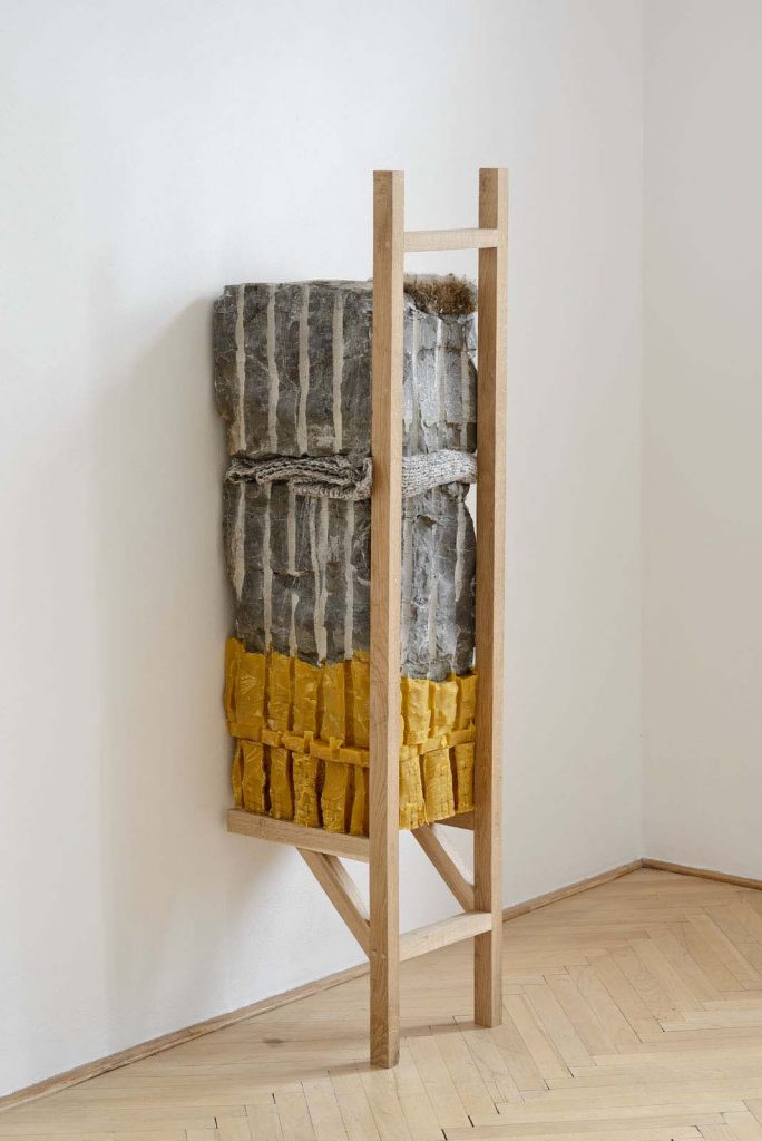 Štefan Papčo, Where I Have Been Not. He Thought of Lightness, 2021, Wood, limestone, beeswax, wool, nest, -in dialogue with time, birds, gravity and unknown, 150 x 39 x 38, unique