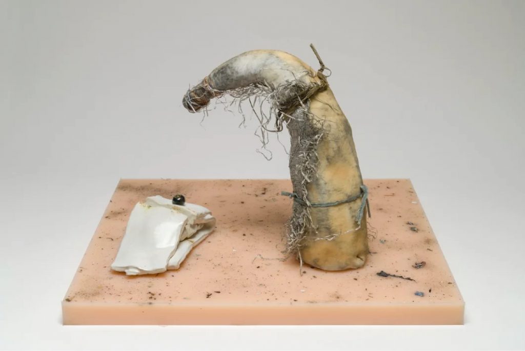 Manuel Mathieu, Wet Mammy, 2021, Silicon, dust, fabric, ceramic, metal wire, 24 x 21 x 14 cm