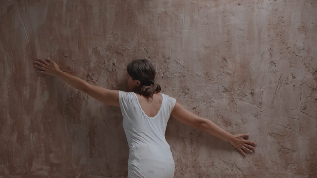 Sarah Brahim, She said, it’s always two bodies, 2023, Video on clay sculpture, 140 x 240 x 6 cm, 36' 48', Courtesy of the artist